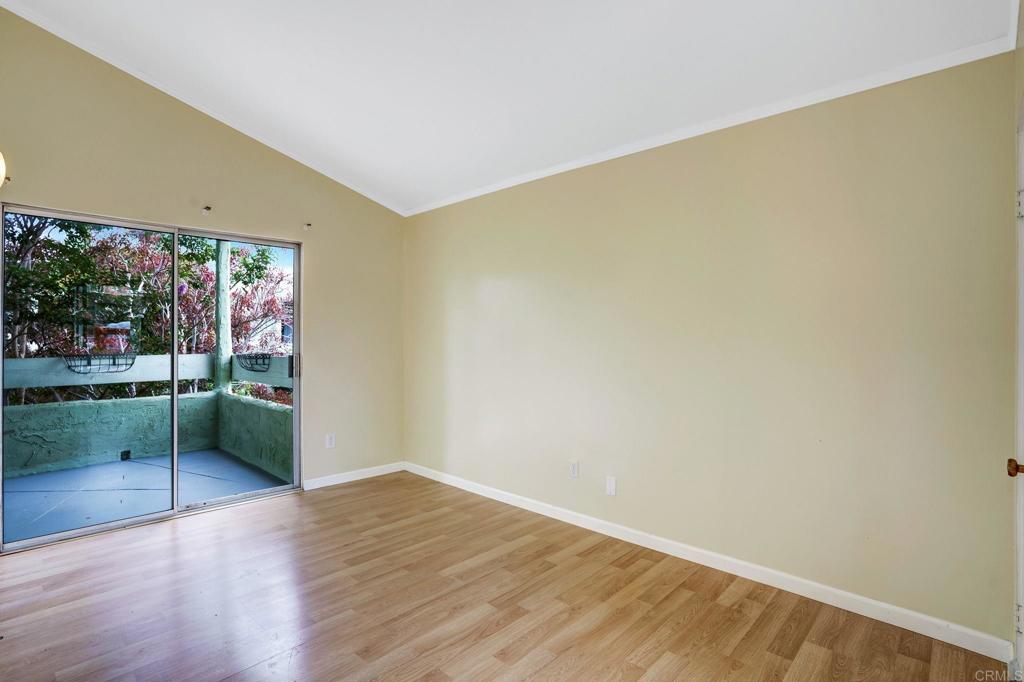 150 E Street, Unit A1 Chula Vista, CA 91910 - Photo 25 of 55 an empty room with wooden floor and outdoor space
