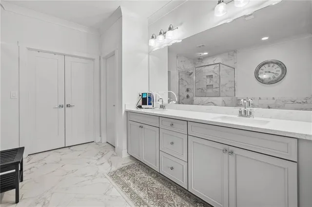 a spacious bathroom with double sink and a mirror