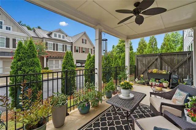 a view of a chairs and table in the patio