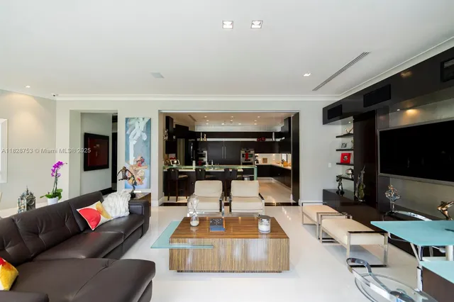 a kitchen with stainless steel appliances kitchen island granite countertop a sink and cabinets