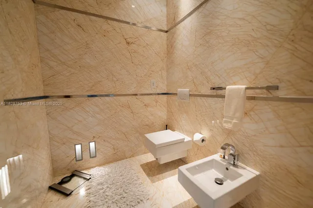 a bathroom with a large tub and sink