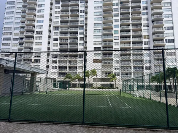 a view of a building with a yard