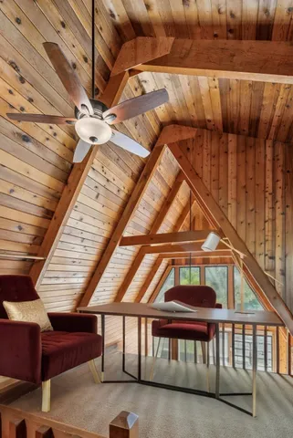 a view of a balcony with furniture