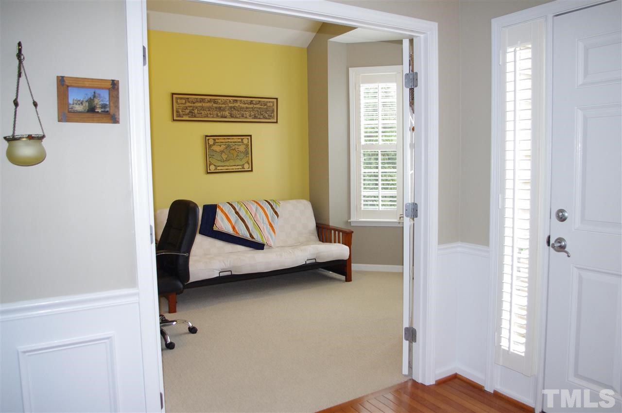 5749 Keowee Way Raleigh, NC 27616 - Photo 5 of 25 French doors and plantation shutters accent this room.
