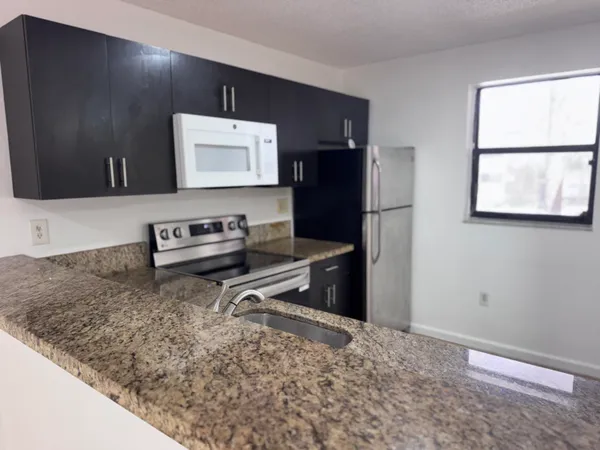 an aerial view of a house with a lake view