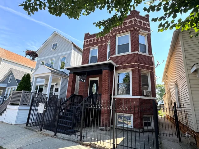 a front view of a house with glass windows