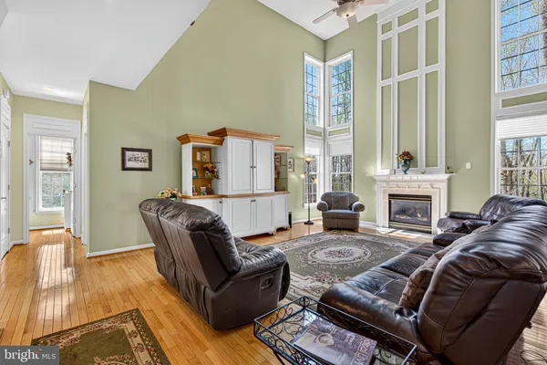 a living room with furniture fireplace and flat screen tv