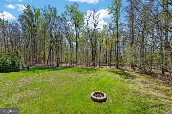 a view of outdoor space with deck and yard