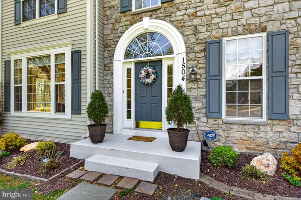 a view of a house with outdoor seating