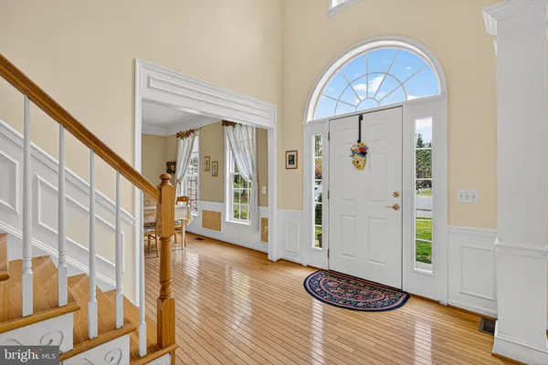 a view of entryway with wooden floor