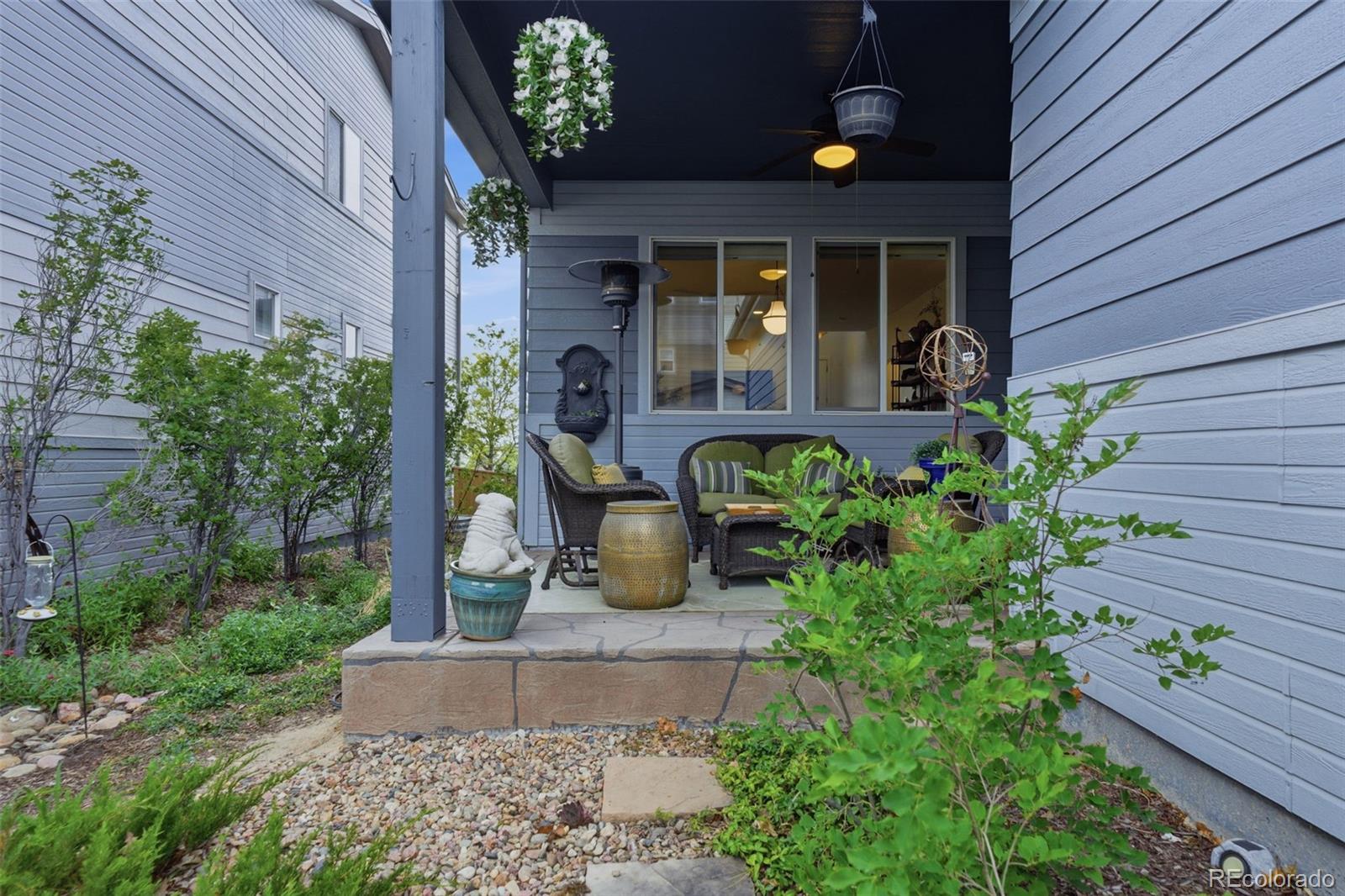 9602 Dunning Circle Highlands Ranch, CO 80126 - Photo 29 of 50 a front view of a house with garden