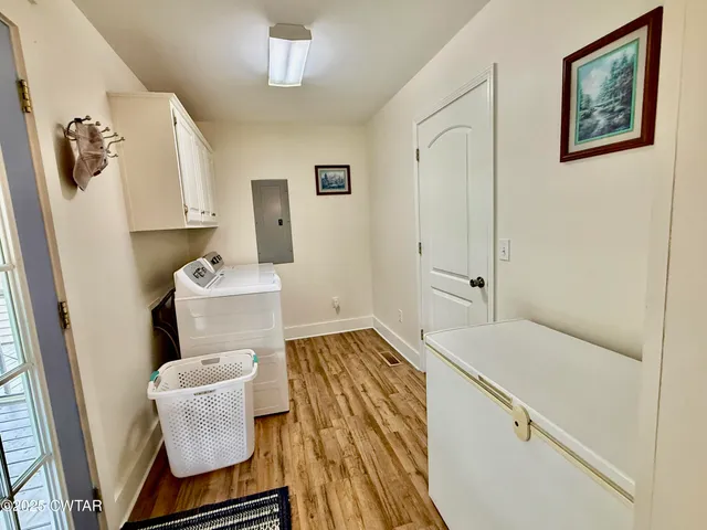 a bathroom with a sink toilet vanity and tub