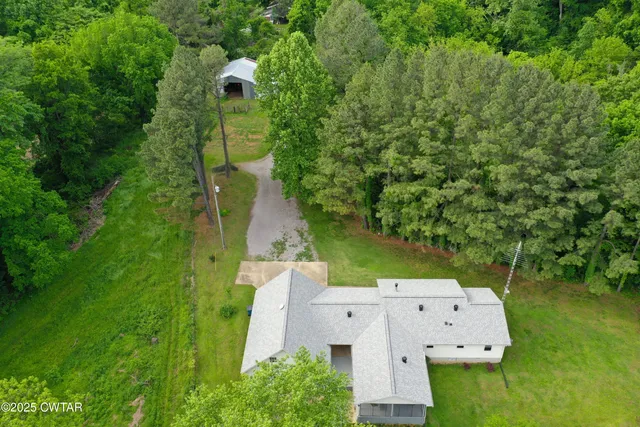 an aerial view of a house with a garden