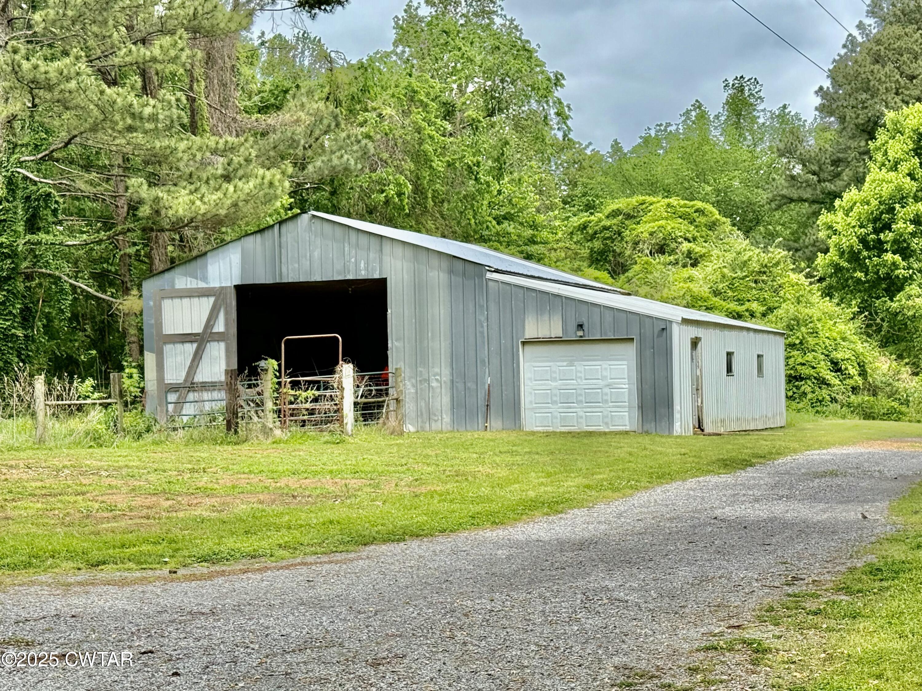 0 Webb Store Road Hornbeak, TN 38232 - Photo 21 of 22 a front view of a house with garden