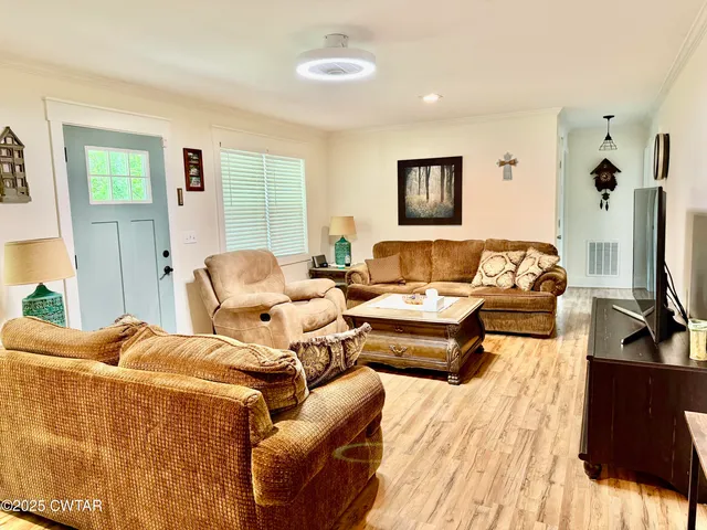 a bedroom with furniture and wooden floor