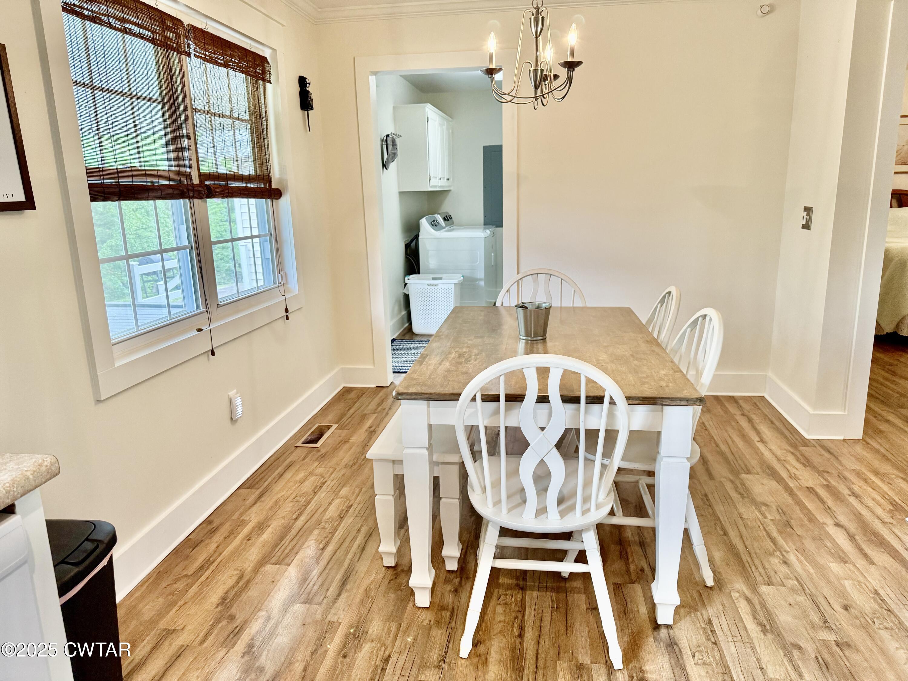 0 Webb Store Road Hornbeak, TN 38232 - Photo 9 of 22 a view of a dining room with furniture and wooden floor