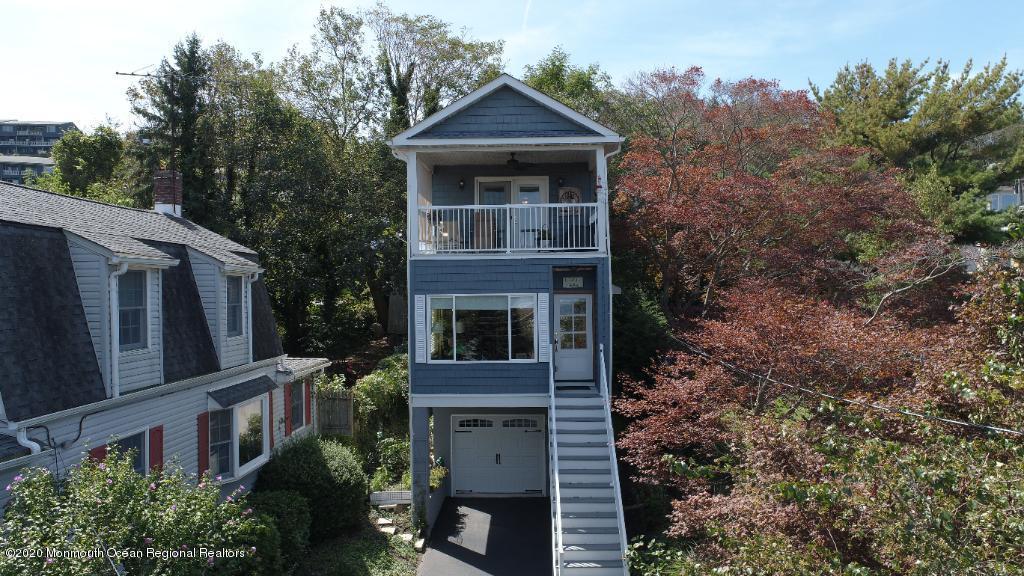 43 Portland Road Highlands, NJ 07732 - Photo 4 of 47 a front view of a house with yard and trees