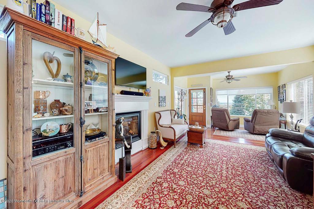 43 Portland Road Highlands, NJ 07732 - Photo 6 of 47 a living room with furniture fireplace and flat screen tv