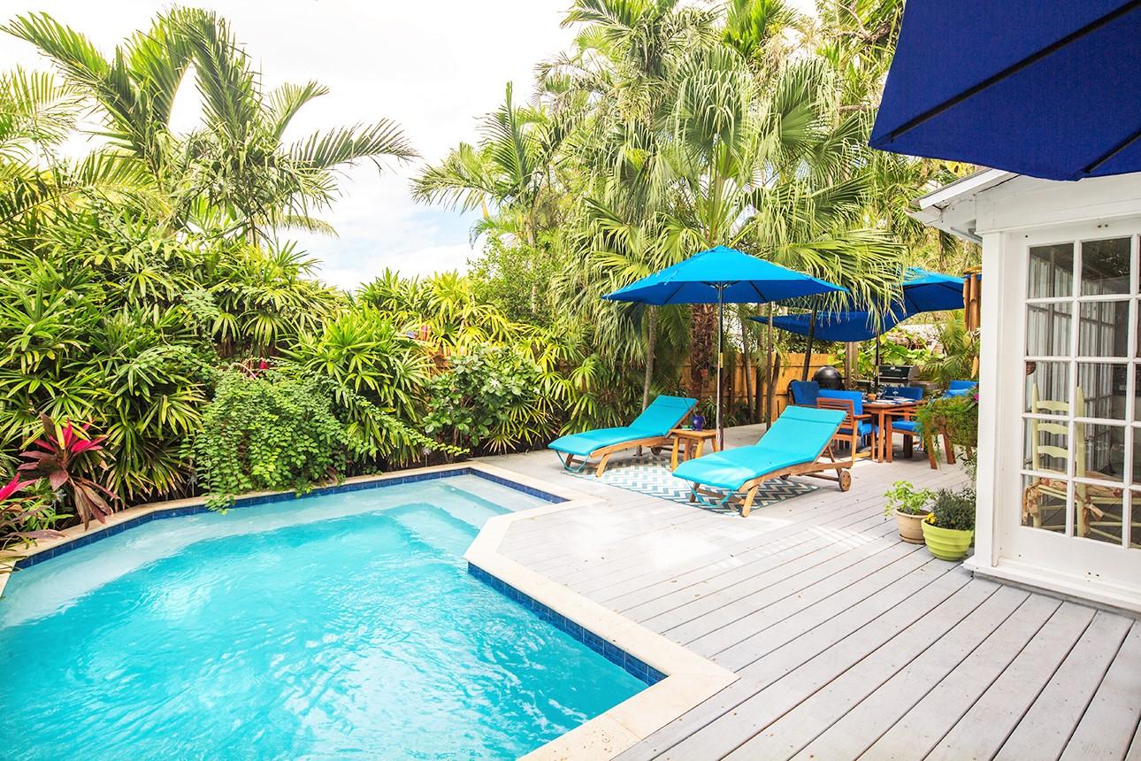 1425 Laird Street Key West, FL 33040 - Photo 11 of 26 a view of a outdoor sitting area with furniture and wooden deck