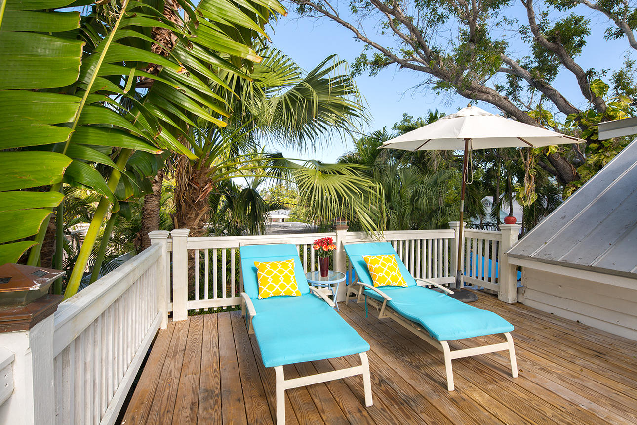 1425 Laird Street Key West, FL 33040 - Photo 15 of 26 a view of deck with chairs and wooden floor