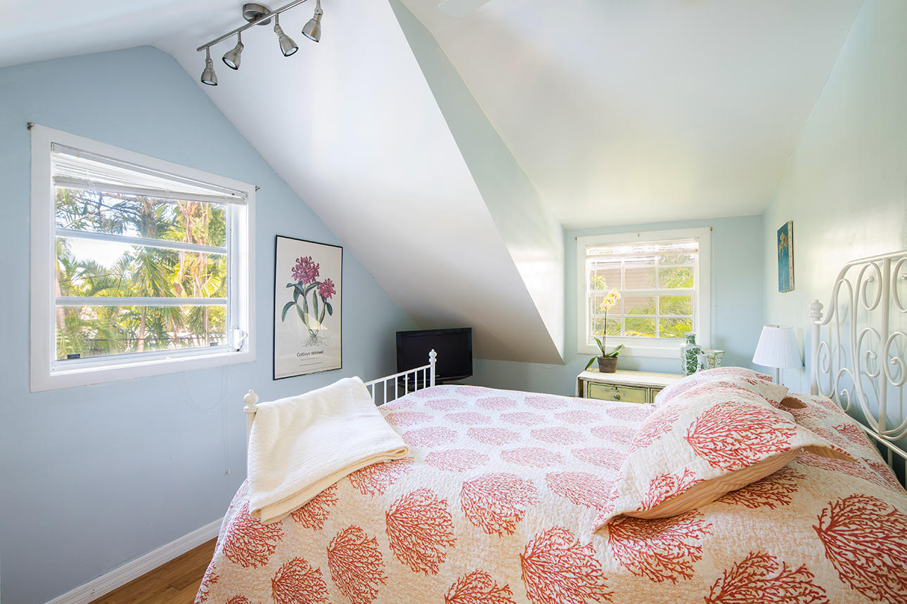 1425 Laird Street Key West, FL 33040 - Photo 18 of 26 a bedroom with a bed and a window