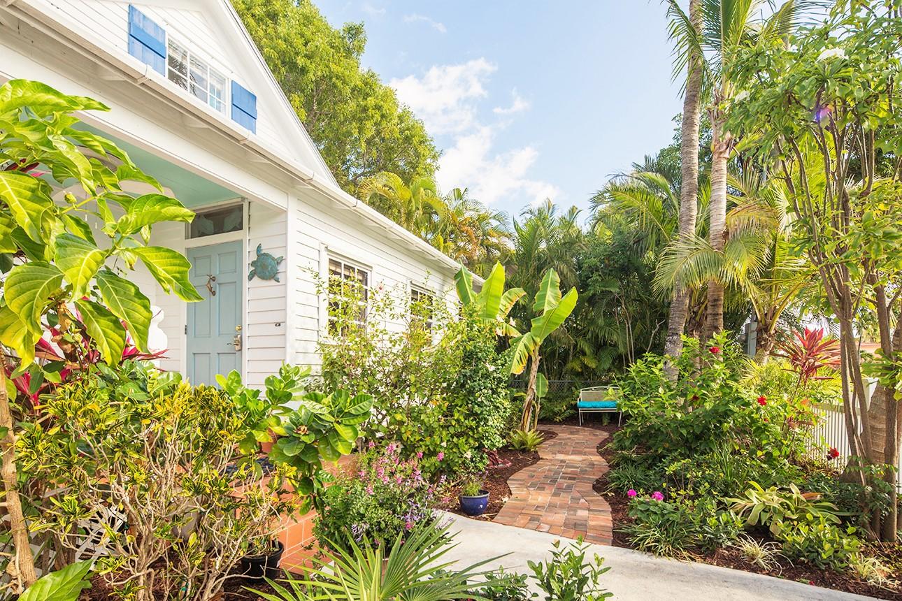1425 Laird Street Key West, FL 33040 - Photo 2 of 26 a view of a garden with plants