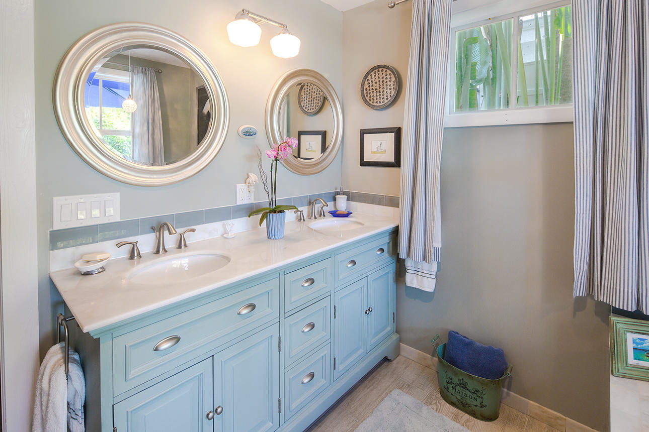 1425 Laird Street Key West, FL 33040 - Photo 22 of 26 a bathroom with a sink and a mirror