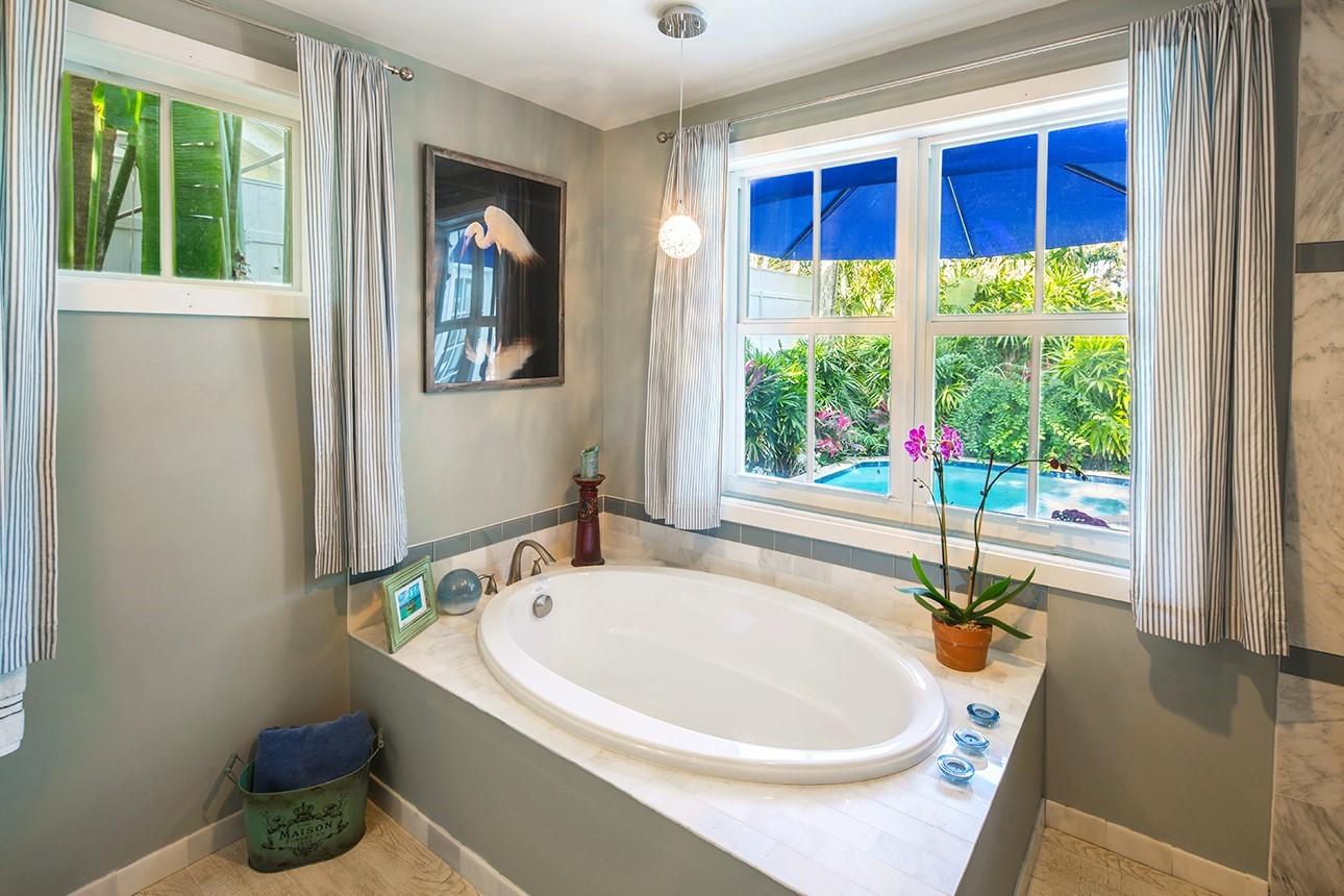 1425 Laird Street Key West, FL 33040 - Photo 23 of 26 a bathroom with a tub and large window