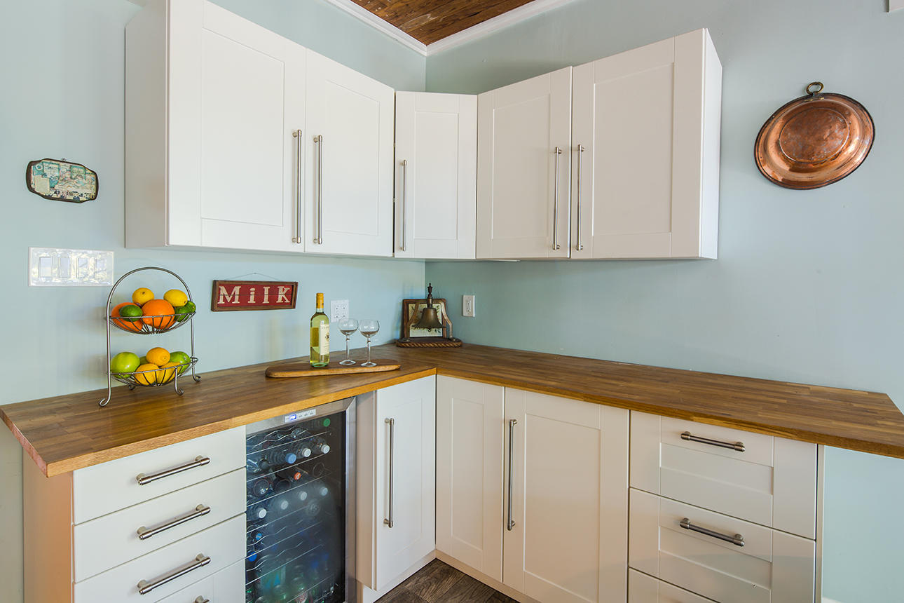 1425 Laird Street Key West, FL 33040 - Photo 9 of 26 a utility room with cabinets and a wooden floors