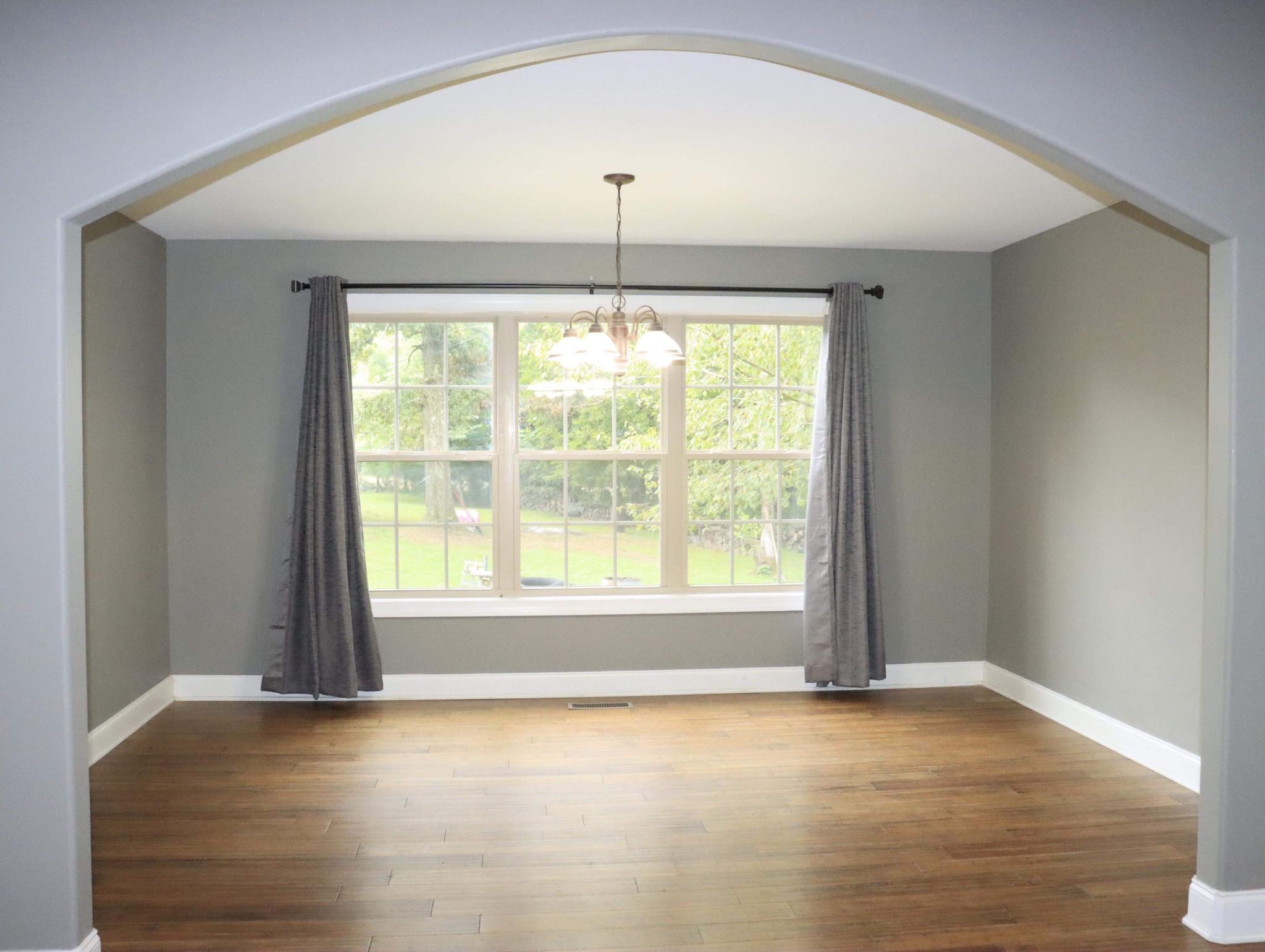 321 South Leath Road Portland, TN 37148 - Photo 13 of 33 an empty room with wooden floor and windows