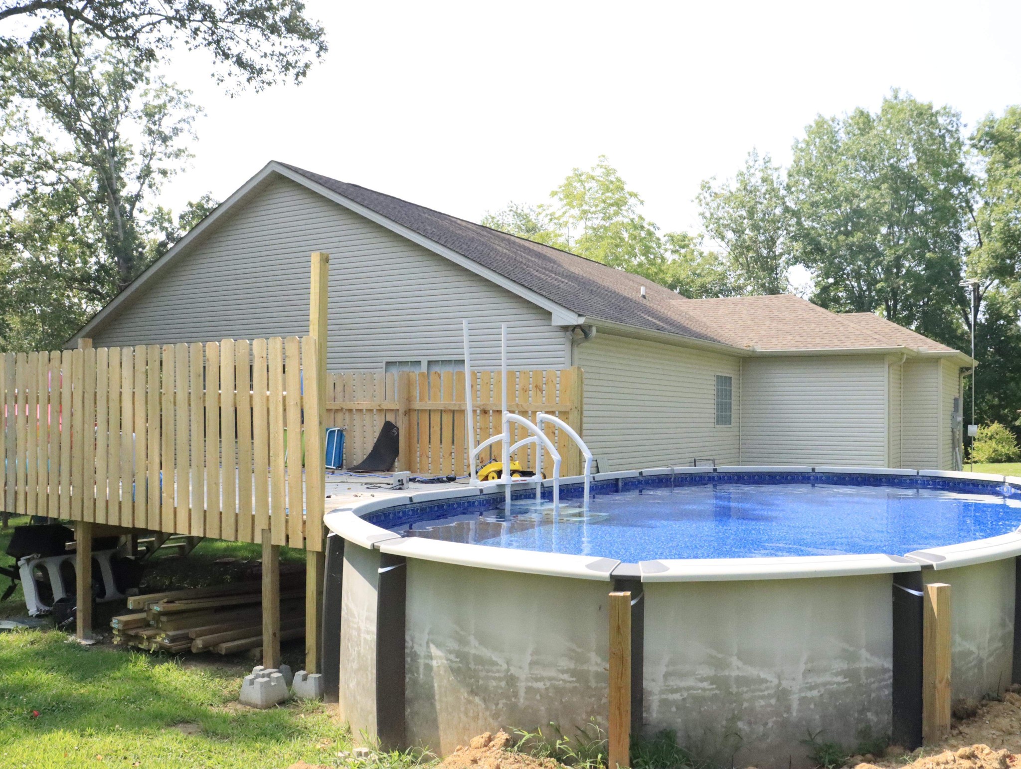 321 South Leath Road Portland, TN 37148 - Photo 4 of 33 a backyard of a house with barbeque oven table and chairs