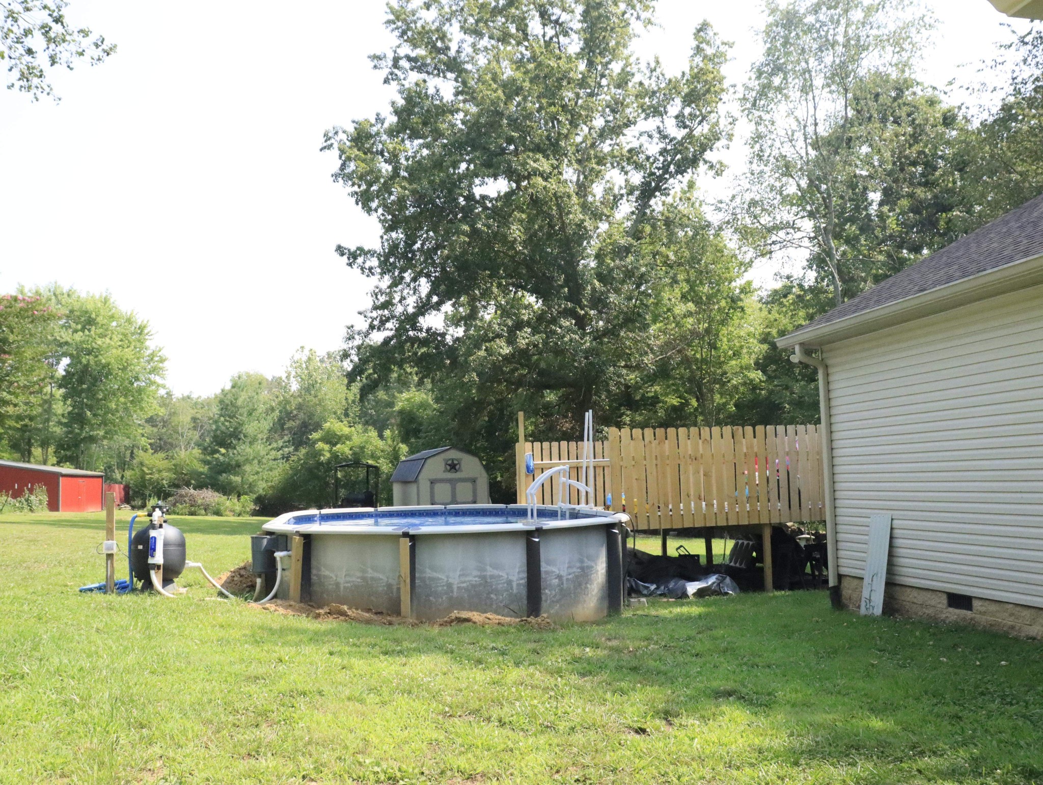 321 South Leath Road Portland, TN 37148 - Photo 6 of 33 a view of a swimming pool with a chair and small yard