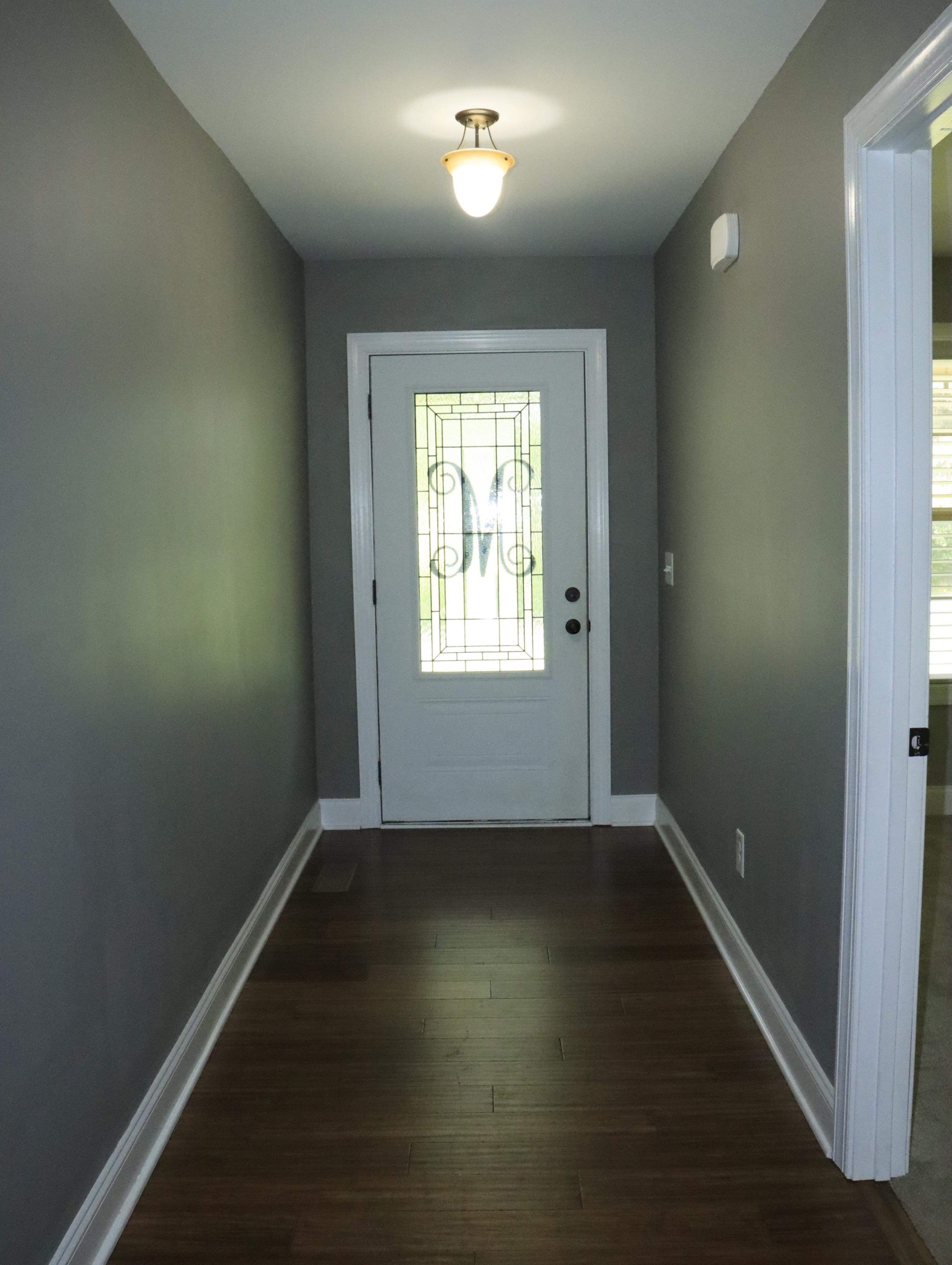 321 South Leath Road Portland, TN 37148 - Photo 7 of 33 an empty room with wooden floor and windows