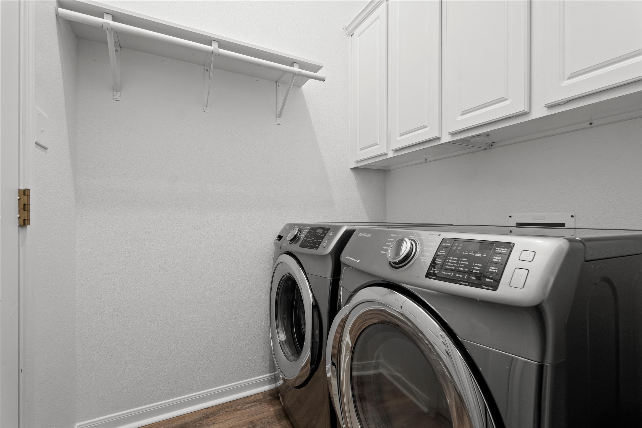 7000 Colberg Court Austin, TX 78749 - Photo 33 of 40 Functional laundry room offers upper cabinets for storage and efficient appliances.