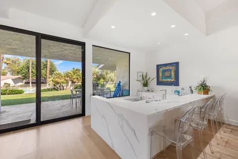 a large kitchen with stainless steel appliances lots of counter top space