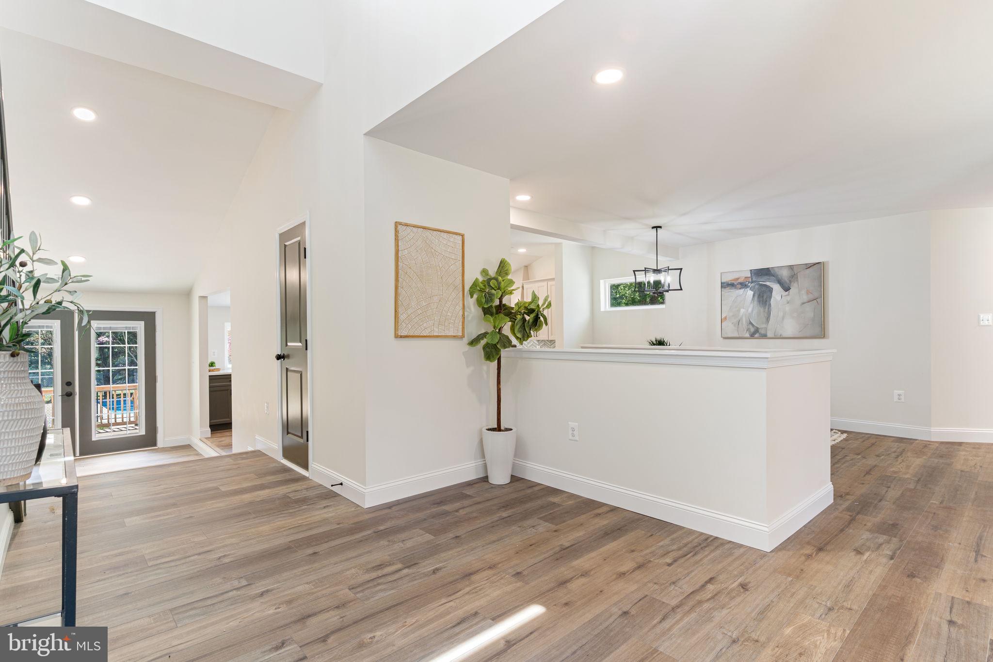 4735 Paul Hance Road Huntingtown, MD 20639 - Photo 5 of 64 a view of a hallway with wooden floor and cabinet