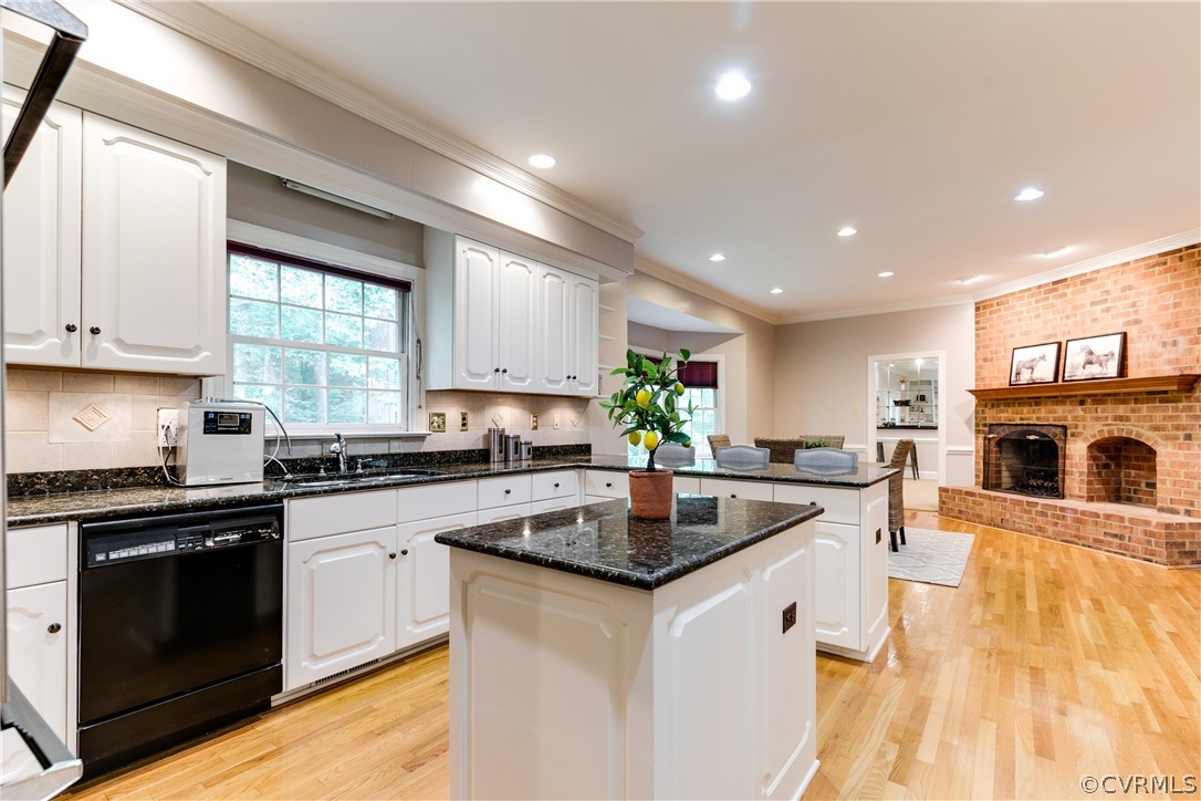 3830 Reeds Landing Circle Midlothian, VA 23113 - Photo 13 of 50 a kitchen with stainless steel appliances granite countertop a sink a stove top oven a counter space and cabinets