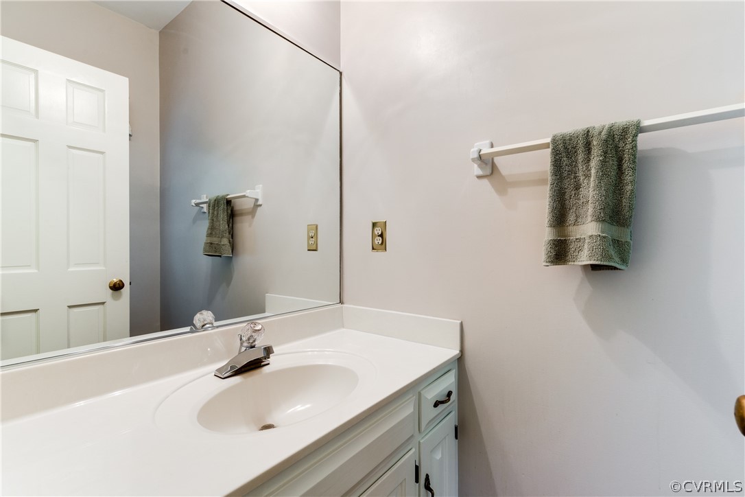3830 Reeds Landing Circle Midlothian, VA 23113 - Photo 29 of 50 a bathroom with a sink and a mirror