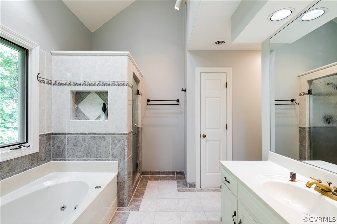 3830 Reeds Landing Circle Midlothian, VA 23113 - Photo 35 of 50 a bathroom with a tub sink and mirror