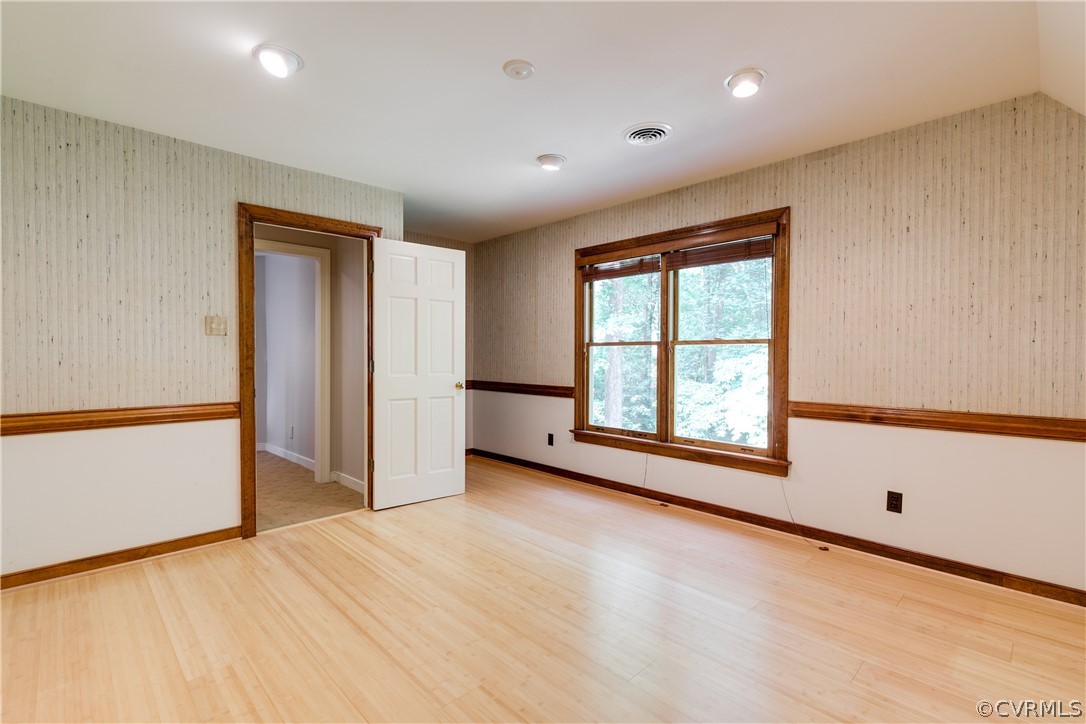 3830 Reeds Landing Circle Midlothian, VA 23113 - Photo 41 of 50 a view of an empty room with a window and wooden floor