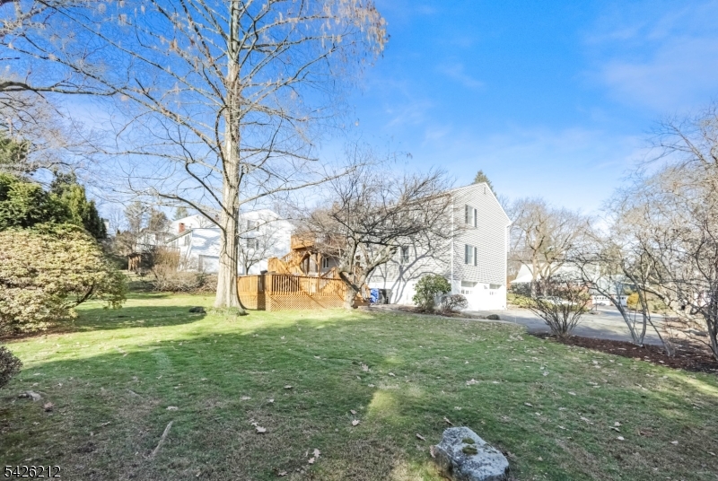 68 Colgate Avenue Paramus, NJ 07652 - Photo 14 of 14 a view of a yard with large trees