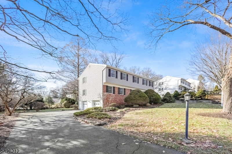 68 Colgate Avenue Paramus, NJ 07652 - Photo 2 of 14 a view of a house with a yard