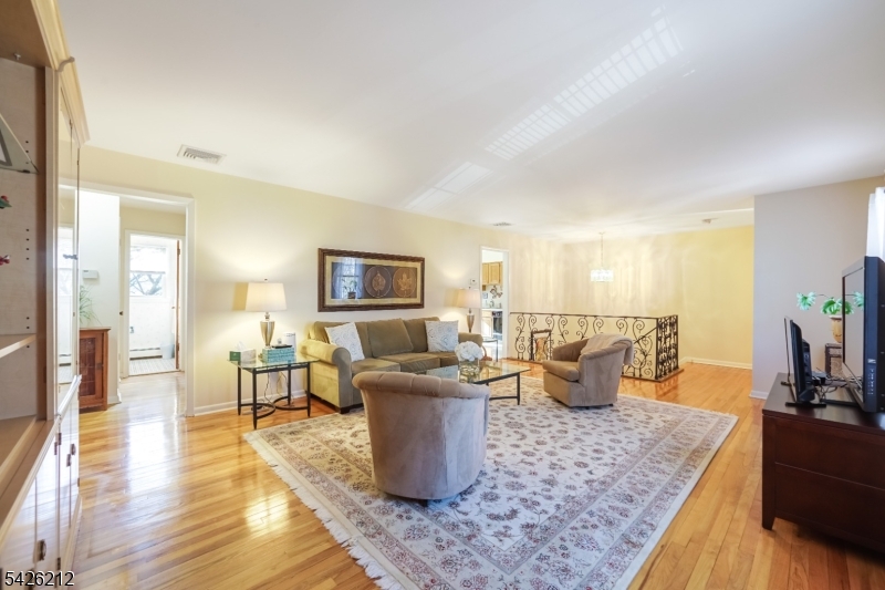 68 Colgate Avenue Paramus, NJ 07652 - Photo 4 of 14 a living room with furniture and wooden floor