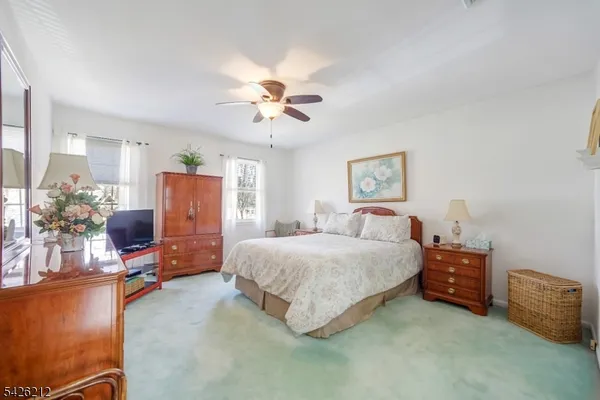a bedroom with a bed furniture and a window