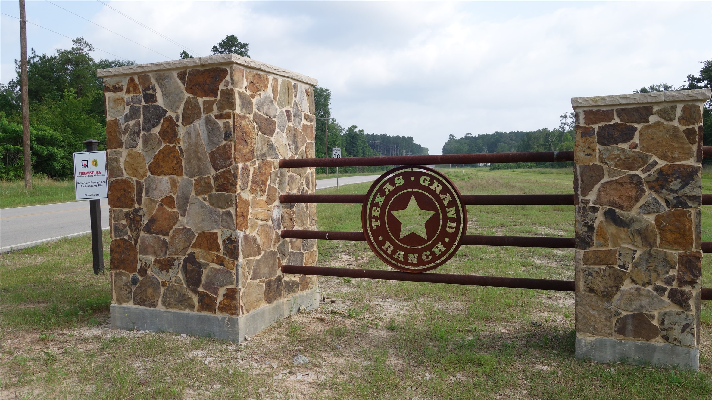 215 Grey Feather Road Huntsville, TX 77340 - Photo 5 of 5 Texas Grand Ranch entrance off of Dipping Vat Rd.