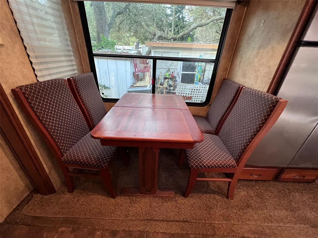 3000 Clarcona Road, Unit 343 Apopka, FL 32703 - Photo 13 of 15 a outdoor dining space with furniture and wooden floor