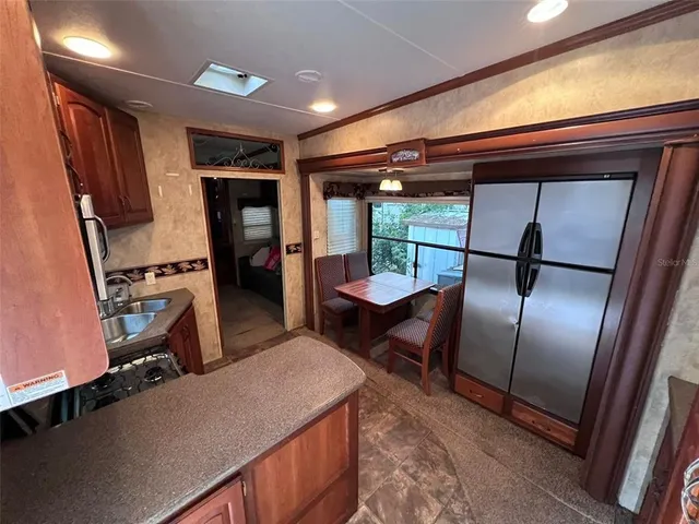 a room with wooden floor and furniture