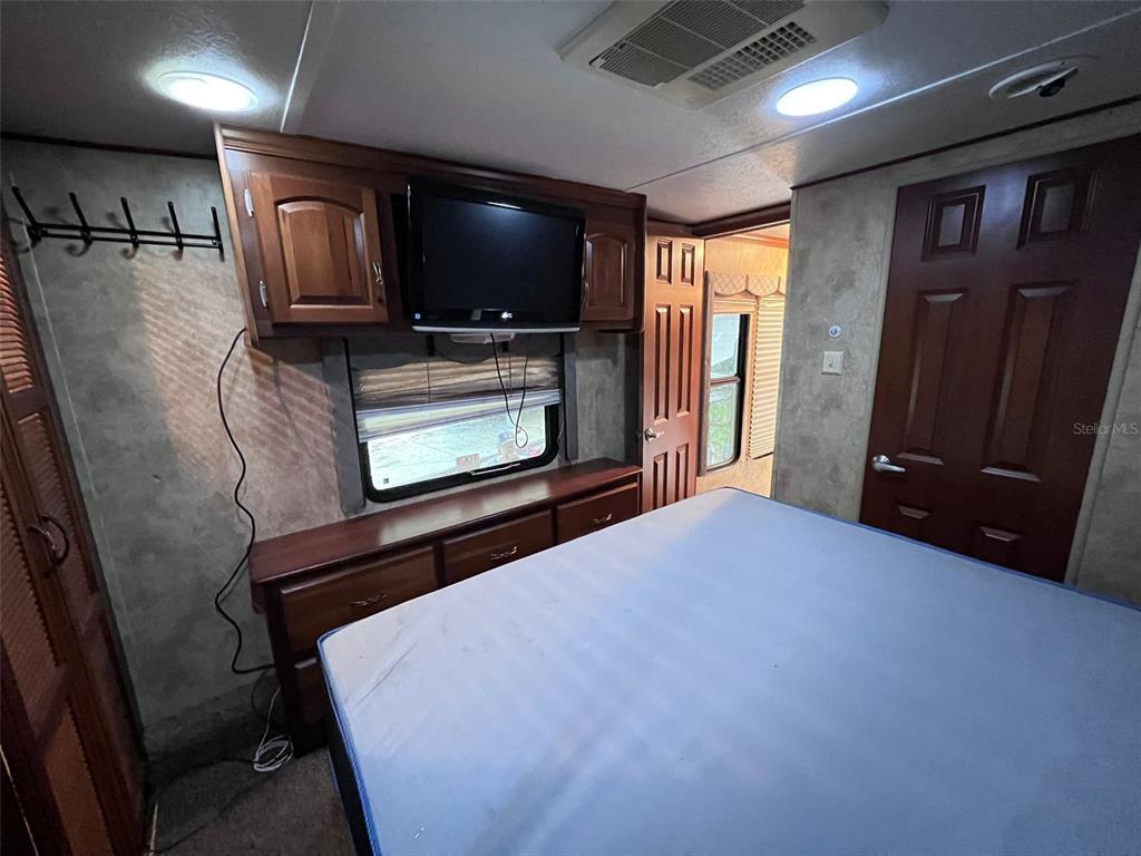 3000 Clarcona Road, Unit 343 Apopka, FL 32703 - Photo 10 of 15 a view of livingroom with furniture and flat screen tv