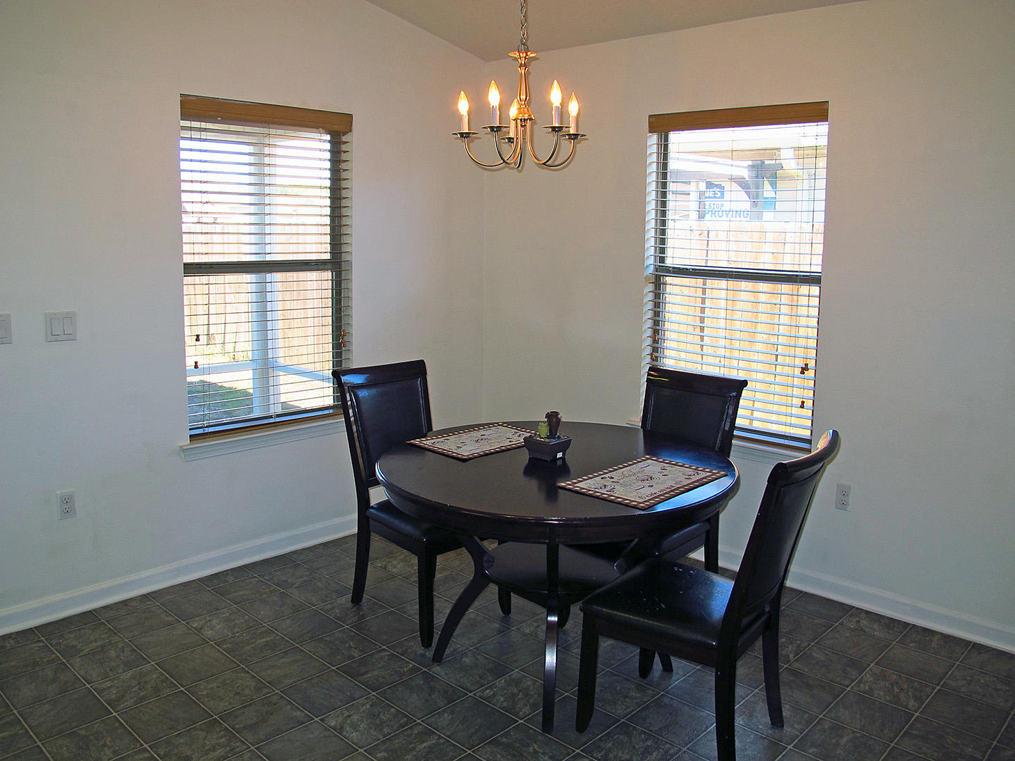 7980 Promise Creek Road Navarre, FL 32566 - Photo 15 of 31 a view of a dining room with furniture and window