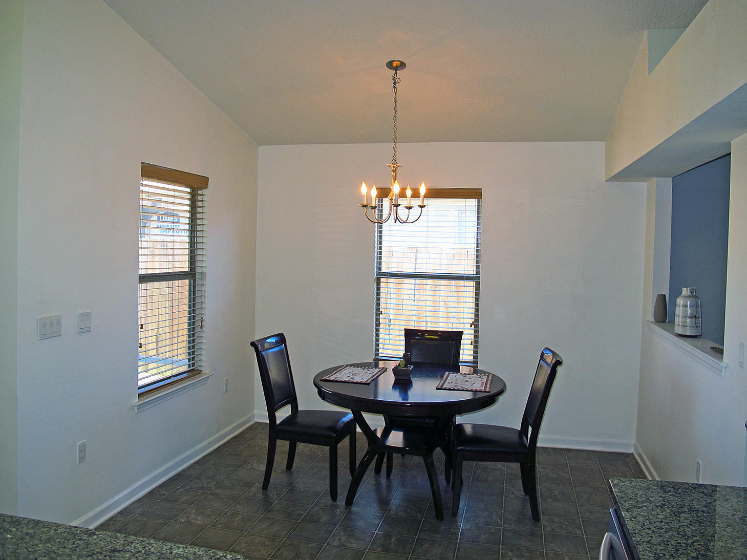 7980 Promise Creek Road Navarre, FL 32566 - Photo 16 of 31 a view of a dining room with furniture window and outside view